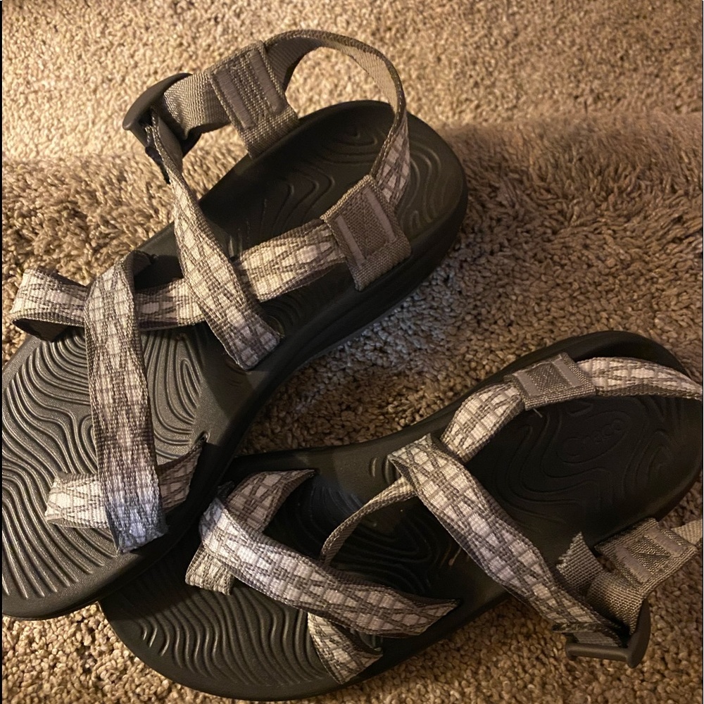 Never worn size 8 chacos. Cut the strap to fit a narrow foot.